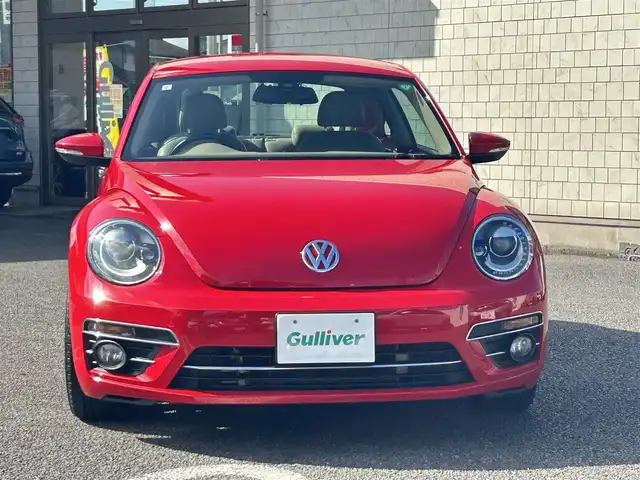 フォルクスワーゲン ザ・ビートル デザイン 大分県 2019(平31)年 8.1万km 赤 Volkswagen 純正ナビゲーションシステム/“716SDCW”【OP】/【Bluetooth/フルセグTV/DVD/CD/SD】/本革シート/前席シートヒーター/社外前後ドライブレコーダー/外部端子接続：USB/バックカメラ/スタティックコーナリングライト/ブラインドスポットディクション/ドライバー疲労検知システム/リアトラフィックアラート/ECS/ABS/ブレーキアシスト/バイセンキセノンヘッドライト【OP】/プッシュスタート/スマートキー2本/保証書/取扱説明書