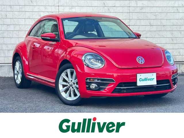 フォルクスワーゲン ザ・ビートル デザイン 大分県 2019(平31)年 8.1万km 赤 Volkswagen 純正ナビゲーションシステム/“716SDCW”【OP】/【Bluetooth/フルセグTV/DVD/CD/SD】/本革シート/前席シートヒーター/社外前後ドライブレコーダー/外部端子接続：USB/バックカメラ/スタティックコーナリングライト/ブラインドスポットディクション/ドライバー疲労検知システム/リアトラフィックアラート/ECS/ABS/ブレーキアシスト/バイセンキセノンヘッドライト【OP】/プッシュスタート/スマートキー2本/保証書/取扱説明書