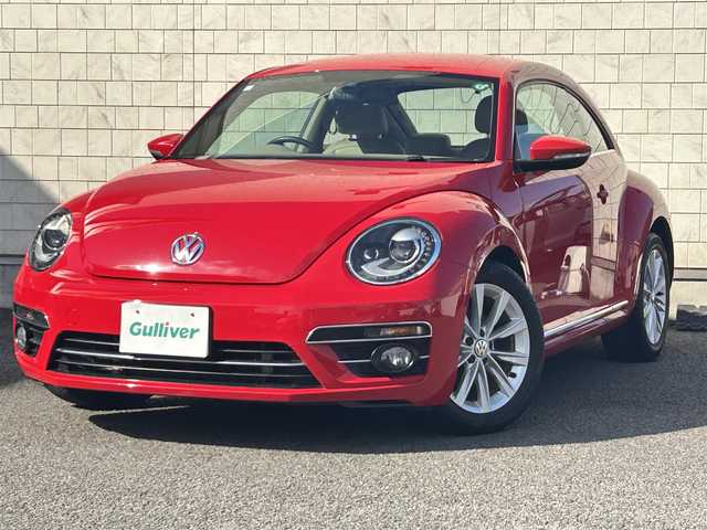 フォルクスワーゲン ザ・ビートル デザイン 大分県 2019(平31)年 8.1万km 赤 Volkswagen 純正ナビゲーションシステム/“716SDCW”【OP】/【Bluetooth/フルセグTV/DVD/CD/SD】/本革シート/前席シートヒーター/社外前後ドライブレコーダー/外部端子接続：USB/バックカメラ/スタティックコーナリングライト/ブラインドスポットディクション/ドライバー疲労検知システム/リアトラフィックアラート/ECS/ABS/ブレーキアシスト/バイセンキセノンヘッドライト【OP】/プッシュスタート/スマートキー2本/保証書/取扱説明書