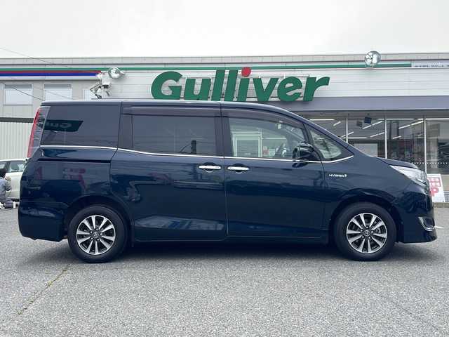 トヨタ エスクァイア ハイブリッド Gi プレミアムパッケージ 愛知県 2018(平30)年 4.8万km ブラッキッシュアゲハガラスフレーク /禁煙/ワンオーナー/ディーラー整備記録簿R2.3.4.5.6//純正ナビ/フルセグ/CD/DVD/SD/MSV/BT//バックカメラ/ビルトインETC/純正ドラレコ//前・後席用USB給電ソケット有//両側パワースライド/純正15インチAW//茶ハーフレザーシート/シートヒーター//コンビステア/ステアスイッチ/ステアヒーター//エアコンドリンクホルダー//リアロールサンシェード//純正LEDオートライト/オートハビーム//純正LEDフォグ//PCS/LDA/クルーズコントロール//純正フロアマット//純正ドアバイザー//新車時保証書//取扱説明書//ナビ取説//スペアスマートキー有