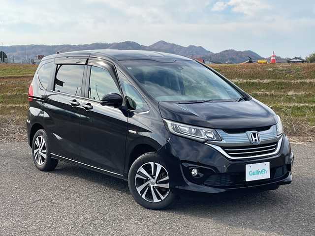 ホンダ フリード ハイブリット G ホンダセンシング 新潟県 2017(平29)年 5.3万km クリスタルブラックパール 4WD/純正9インチSDナビ（VXM-185VFNi）/CD/DVD/BT/フルセグテレビ/SDミュージックサーバー/バックカメラ/ETC/ドライブレコーダー/衝突被害軽減ブレーキ/レーンキープアシスト/レーダークルーズコントロール/両側パワースライドドア/半革シート/シートヒーター/ステアリングスイッチ/スマートキー/プッシュスタート/LEDヘッドライト/オートライト/フォグランプ/純正15インチアルミホイール