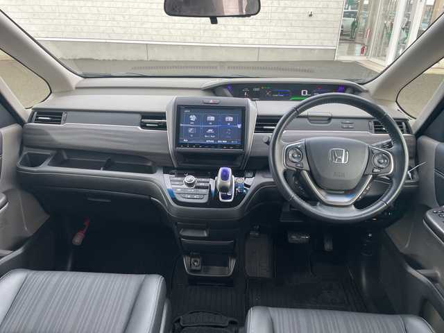 ホンダ フリード ハイブリット G ホンダセンシング 山形県 2017(平29)年 5.3万km クリスタルブラックパール 4WD/純正9インチSDナビ（VXM-185VFNi）/CD/DVD/BT/フルセグテレビ/SDミュージックサーバー/バックカメラ/ETC/ドライブレコーダー/衝突被害軽減ブレーキ/レーンキープアシスト/レーダークルーズコントロール/両側パワースライドドア/半革シート/シートヒーター/ステアリングスイッチ/スマートキー/プッシュスタート/LEDヘッドライト/オートライト/フォグランプ/純正15インチアルミホイール