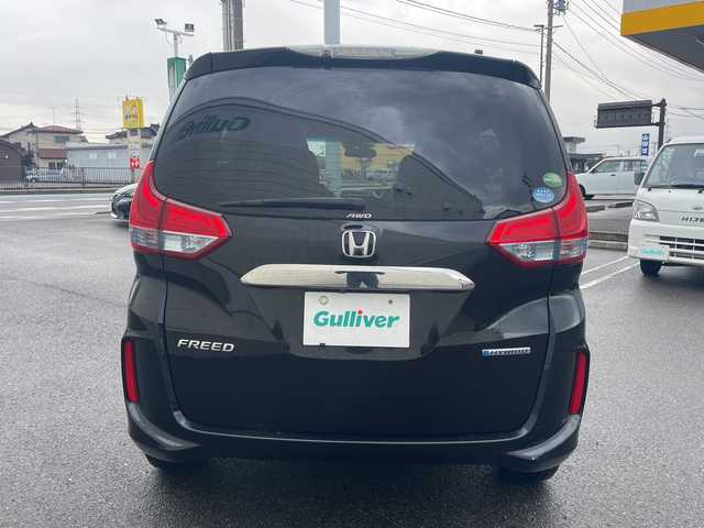 ホンダ フリード ハイブリット G ホンダセンシング 山形県 2017(平29)年 5.3万km クリスタルブラックパール 4WD/純正9インチSDナビ（VXM-185VFNi）/CD/DVD/BT/フルセグテレビ/SDミュージックサーバー/バックカメラ/ETC/ドライブレコーダー/衝突被害軽減ブレーキ/レーンキープアシスト/レーダークルーズコントロール/両側パワースライドドア/半革シート/シートヒーター/ステアリングスイッチ/スマートキー/プッシュスタート/LEDヘッドライト/オートライト/フォグランプ/純正15インチアルミホイール