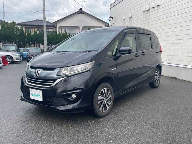 ホンダ フリード ハイブリット G ホンダセンシング 山形県 2017(平29)年 5.3万km クリスタルブラックパール 4WD/純正9インチSDナビ（VXM-185VFNi）/CD/DVD/BT/フルセグテレビ/SDミュージックサーバー/バックカメラ/ETC/ドライブレコーダー/衝突被害軽減ブレーキ/レーンキープアシスト/レーダークルーズコントロール/両側パワースライドドア/半革シート/シートヒーター/ステアリングスイッチ/スマートキー/プッシュスタート/LEDヘッドライト/オートライト/フォグランプ/純正15インチアルミホイール