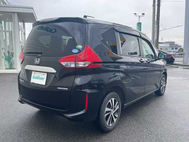 ホンダ フリード ハイブリット G ホンダセンシング 山形県 2017(平29)年 5.3万km クリスタルブラックパール 4WD/純正9インチSDナビ（VXM-185VFNi）/CD/DVD/BT/フルセグテレビ/SDミュージックサーバー/バックカメラ/ETC/ドライブレコーダー/衝突被害軽減ブレーキ/レーンキープアシスト/レーダークルーズコントロール/両側パワースライドドア/半革シート/シートヒーター/ステアリングスイッチ/スマートキー/プッシュスタート/LEDヘッドライト/オートライト/フォグランプ/純正15インチアルミホイール