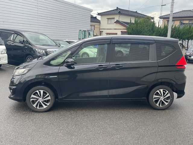 ホンダ フリード ハイブリット G ホンダセンシング 山形県 2017(平29)年 5.3万km クリスタルブラックパール 4WD/純正9インチSDナビ（VXM-185VFNi）/CD/DVD/BT/フルセグテレビ/SDミュージックサーバー/バックカメラ/ETC/ドライブレコーダー/衝突被害軽減ブレーキ/レーンキープアシスト/レーダークルーズコントロール/両側パワースライドドア/半革シート/シートヒーター/ステアリングスイッチ/スマートキー/プッシュスタート/LEDヘッドライト/オートライト/フォグランプ/純正15インチアルミホイール