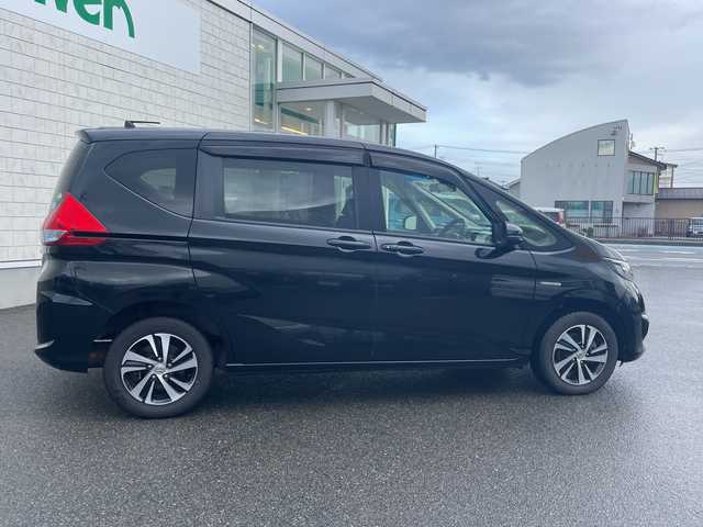 ホンダ フリード ハイブリット G ホンダセンシング 山形県 2017(平29)年 5.3万km クリスタルブラックパール 4WD/純正9インチSDナビ（VXM-185VFNi）/CD/DVD/BT/フルセグテレビ/SDミュージックサーバー/バックカメラ/ETC/ドライブレコーダー/衝突被害軽減ブレーキ/レーンキープアシスト/レーダークルーズコントロール/両側パワースライドドア/半革シート/シートヒーター/ステアリングスイッチ/スマートキー/プッシュスタート/LEDヘッドライト/オートライト/フォグランプ/純正15インチアルミホイール