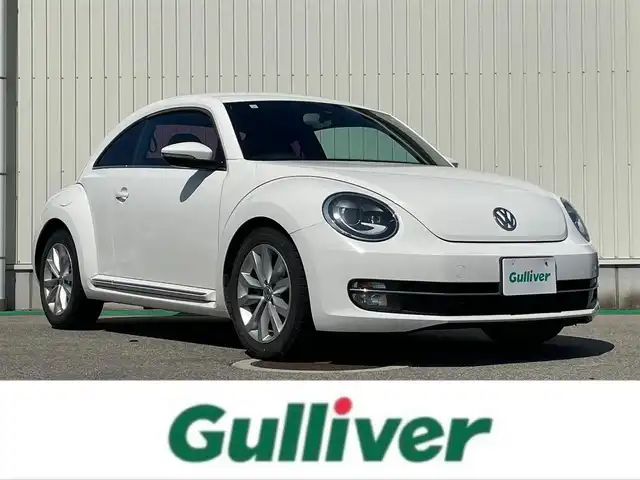 フォルクスワーゲン ザ・ビートル デザイン レザーパッケージ 富山県 2013(平25)年 8.7万km 白 ワンオーナー／/社外７インチナビ／/フルセグＴＶ／/Ｂｌｕｅｔｏｏｔｈ／/ＤＶＤ再生／/ブラックレザーシート／/クルーズコントロール／/運転席シートヒーター／/助手席シートヒーター／/ＡＵＸ／/ステアリングスイッチ