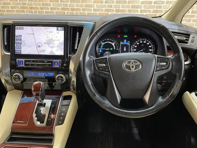 トヨタ ヴェルファイア ハイブリット X 岩手県 2015(平27)年 11.5万km ブラック ４WD/寒冷地仕様/ツインムーンルーフ/ALPINE12.8インチ後席ディスプレイ/ALPINE10インチナビゲーション/両側パワースライドドア/クルーズコントロール/クリアランスソナー/横滑り防止装置/MTモード付AT/オートブレーキホールド/AC100V1500Wアクセサリーコンセント/Clazzioレザー調シートカバー/２列目シートオットマン/リヤオートエアコン/バックカメラ/ETC/エンジンスターター/フルセグTV/LEDヘッドライト/フロント・リヤフォグランプ/ワイパーデアイサー/純正16インチアルミホイール