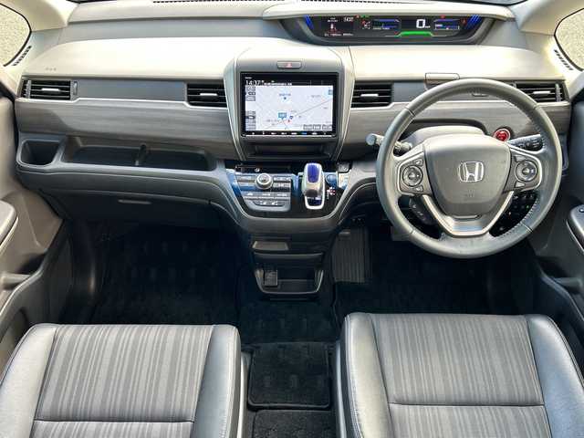 ホンダ フリード ハイブリット EX 石川県 2017(平29)年 6万km ホワイトオーキッドパール 純正SDナビ（DVD再生機能有）/ETC/ドライブレコーダー/Bluetooth/バックカメラ/フルセグTV/シートヒーター/ハーフレザーシート/衝突警報装置/レーンアシスト/両側パワースライドドア/LEDヘッドライト/レーダークルーズコントロール/スマートキー/純正15インチアルミ