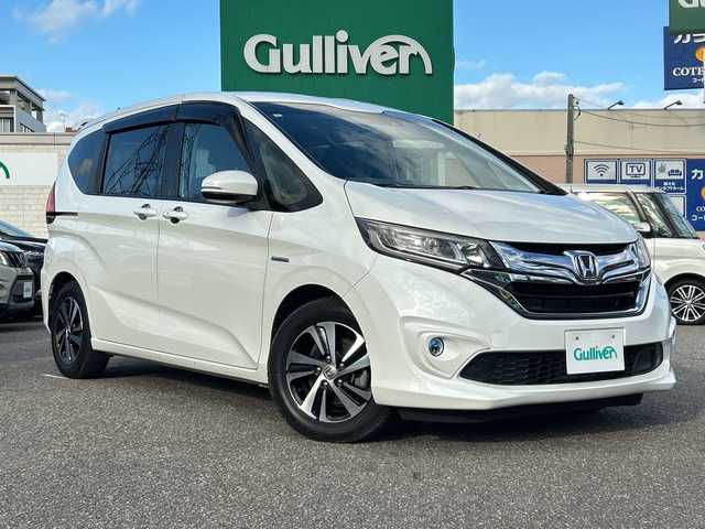 ホンダ フリード ハイブリット EX 石川県 2017(平29)年 6万km ホワイトオーキッドパール 純正SDナビ（DVD再生機能有）/ETC/ドライブレコーダー/Bluetooth/バックカメラ/フルセグTV/シートヒーター/ハーフレザーシート/衝突警報装置/レーンアシスト/両側パワースライドドア/LEDヘッドライト/レーダークルーズコントロール/スマートキー/純正15インチアルミ