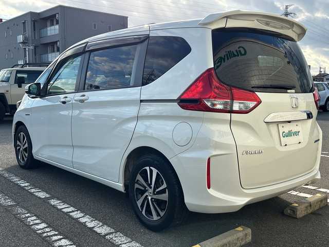 ホンダ フリード ハイブリット EX 石川県 2017(平29)年 6万km ホワイトオーキッドパール 純正SDナビ（DVD再生機能有）/ETC/ドライブレコーダー/Bluetooth/バックカメラ/フルセグTV/シートヒーター/ハーフレザーシート/衝突警報装置/レーンアシスト/両側パワースライドドア/LEDヘッドライト/レーダークルーズコントロール/スマートキー/純正15インチアルミ