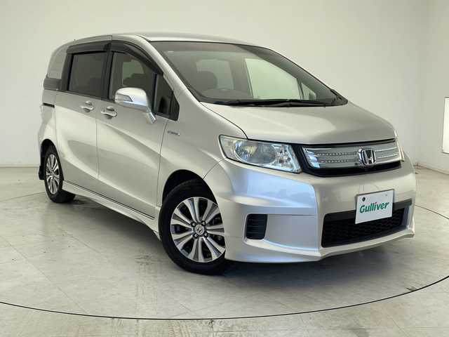 ホンダ フリード スパイク ハイブリット ジャストセレクション 千葉県 2012(平24)年 7.4万km スーパープラチナメタリック クルーズコントロール/純正メモリナビ/（ワンセグ/CD/DVD/FM/AM）/バックカメラ/アイドリングストップ/ETC/スマートキー/ステアリングスイッチ/両側パワースライドドア/純正フロアマット/キセノンヘッドライト