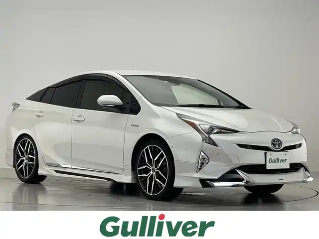 トヨタ プリウス Sセーフティプラス 滋賀県 2017(平29)年 7.4万km ホワイトパールクリスタルシャイン 禁煙車/純正９インチナビ/CD.DVD.Bluetooth.フルセグ/バックカメラ/モデリスタエアロ/プリクラッシュセーフティ/追従クルーズコントロール/レーンキープアシスト/レザー調シートカバー/ETC2.0/オートライト/オートハイビーム/LEDヘッドライト/ステアリングスイッチ/パーキングアシスト