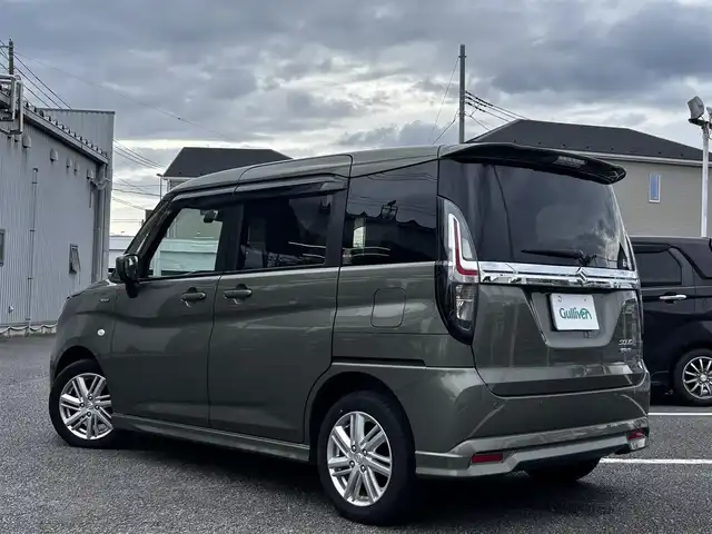 スズキ ソリオ HV MX 静岡県 2024(令6)年 0.7万km タフカーキパールメタリック ユーザー買取車両/ワンオーナー/純正ナビ/　【CD/DVD/BT/地デジフルセグTV】/純正LEDヘッドライト/純正15インチAW/衝突被害軽減システム/車線逸脱警報/レーダークルーズコントロール/全方位カメラ/ビルトインETC/前席シートヒーター/ドライブレコーダー/片側パワースライドドア/USBポート/新車時保証書/取扱説明書/スペアキー×1
