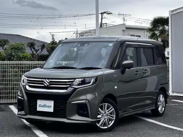 スズキ ソリオ HV MX 静岡県 2024(令6)年 0.7万km タフカーキパールメタリック ユーザー買取車両/ワンオーナー/純正ナビ/　【CD/DVD/BT/地デジフルセグTV】/純正LEDヘッドライト/純正15インチAW/衝突被害軽減システム/車線逸脱警報/レーダークルーズコントロール/全方位カメラ/ビルトインETC/前席シートヒーター/ドライブレコーダー/片側パワースライドドア/USBポート/新車時保証書/取扱説明書/スペアキー×1