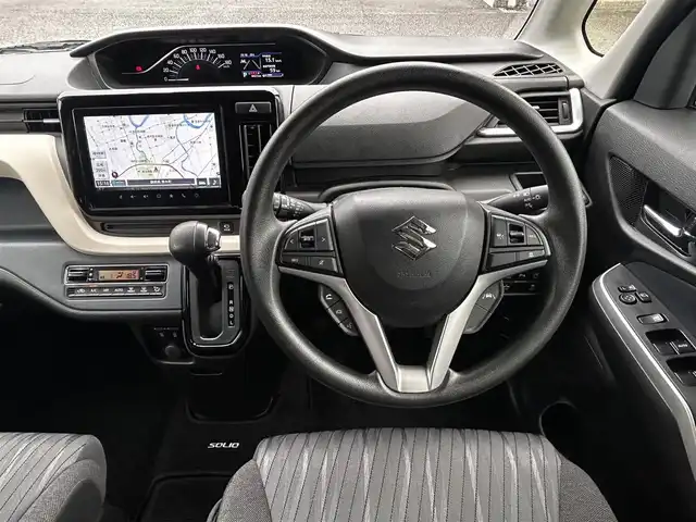 スズキ ソリオ HV MX 静岡県 2024(令6)年 0.7万km タフカーキパールメタリック ユーザー買取車両/ワンオーナー/純正ナビ/　【CD/DVD/BT/地デジフルセグTV】/純正LEDヘッドライト/純正15インチAW/衝突被害軽減システム/車線逸脱警報/レーダークルーズコントロール/全方位カメラ/ビルトインETC/前席シートヒーター/ドライブレコーダー/片側パワースライドドア/USBポート/新車時保証書/取扱説明書/スペアキー×1