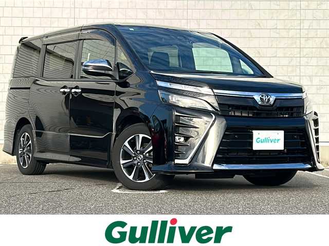 トヨタ ヴォクシー ZS 煌Ⅲ 新潟県 2021(令3)年 5.9万km ブラック ワンオーナー/衝突軽減/純正9型ナビ/(AM/FM/CD/DVD/BT/フルセグ)/フリップダウンモニター/両側パワースライドドア/バックカメラ/ETC/ドライブレコーダー/クルーズコントロール/アイドリングストップ/コーナーセンサー/MTモード付きAT/ハーフレザーシート/革巻きステアリング/ステアリングスイッチ/AUTOライト/LEDヘッドライト/フォグランプ/電格ミラー/プッシュスタート/スマートキー