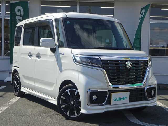 スズキ スペーシア カスタム HYBRID XS ターボ 静岡県 2019(令1)年 3.8万km ピュアホワイトP ワンオーナー/禁煙車/ターボ車/車検令和8年5月28日まで/両側パワースライドドア/運転席シートヒーター/KENWOOD SDナビ（MDVーM705）/（CD/DVD/SD/USB/BT/フルセグTV)/2列目ロールサンシェード/運転席・助手席シートバックテーブル/プッシュスタート・スマートキー/革巻きステアリング/パドルシフト/社外ETC/コムテックドラレコ（前後）/セーフティサポート/・デュアルセンサーブレーキサポート/・車線逸脱警報機能/・先行車発進お知らせ機能/・後退時ブレーキサポート/・リアパーキングセンサー/・誤発進抑制機能/・ふらつき警報機能/・ハイビームアシスト/・後方誤発進抑制機能/ウインカー付き電動格納ミラー/LEDヘッドライト/スペアキー/保証書・取扱説明書