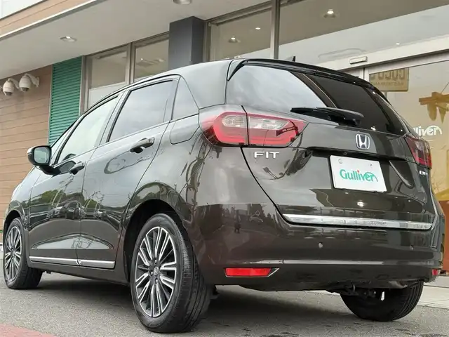 ホンダ フィット e:HEVリュクス 香川県 2020(令2)年 3.6万km プレミアムグラマラスブロンズP 純正8インチSDナビ/フルセグ/CD/DVD/Bluetooth/バックカメラ/純正16インチアルミ/LEDヘッドライト/ホンダセンシング/レーダークルーズコントロール/コーナーセンサー/ハーフレザーシート/前席シートヒーター/ドライブレコーダー/ハンドルヒーター/置くだけ充電/ETC