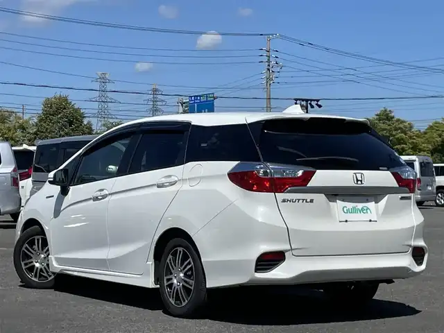 ホンダ シャトル ハイブリッド X ホンダセンシング 栃木県 2018(平30)年 6万km ホワイトオーキッドパール ワンオーナー/社外メモリナビ/　AM/FM/SD/DVD/BT/フルセグ/ホンダセンシング/衝突被害軽減ブレーキ/横滑り防止装置/アダプティブクルーズコントロール/レーンキープ/バックカメラ/ビルトインETC/ドライブレコーダー/アイドリングストップ/ECOMODE/Sモード/シートヒーター/ハーフレザー/革巻きステアリング/ステアリングリモコン/パドルシフト/MTモード付AT/レーダー探知機/プッシュスタート/スマートキー/LEDヘッドライト/オートライト/フォグランプ/電動格納ミラー/ウィンカーミラー/純正フロアマット/ドアバイザー/スペアキー