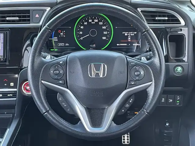 ホンダ シャトル ハイブリッド X ホンダセンシング 栃木県 2018(平30)年 6万km ホワイトオーキッドパール ワンオーナー/社外メモリナビ/　AM/FM/SD/DVD/BT/フルセグ/ホンダセンシング/衝突被害軽減ブレーキ/横滑り防止装置/アダプティブクルーズコントロール/レーンキープ/バックカメラ/ビルトインETC/ドライブレコーダー/アイドリングストップ/ECOMODE/Sモード/シートヒーター/ハーフレザー/革巻きステアリング/ステアリングリモコン/パドルシフト/MTモード付AT/レーダー探知機/プッシュスタート/スマートキー/LEDヘッドライト/オートライト/フォグランプ/電動格納ミラー/ウィンカーミラー/純正フロアマット/ドアバイザー/スペアキー