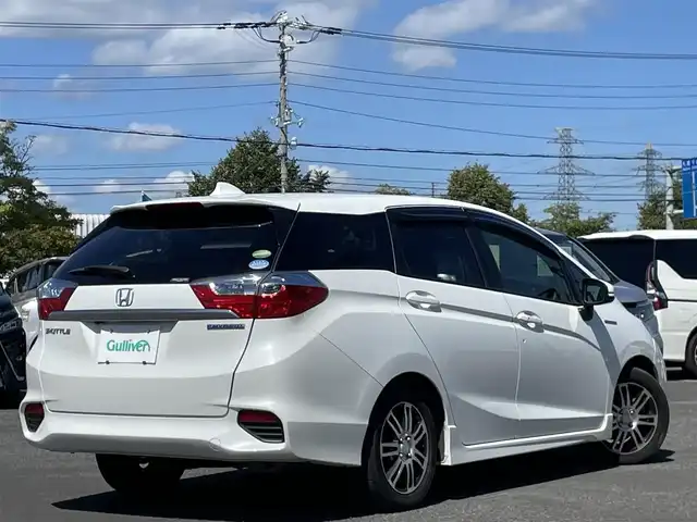 ホンダ シャトル ハイブリッド X ホンダセンシング 栃木県 2018(平30)年 6万km ホワイトオーキッドパール ワンオーナー/社外メモリナビ/　AM/FM/SD/DVD/BT/フルセグ/ホンダセンシング/衝突被害軽減ブレーキ/横滑り防止装置/アダプティブクルーズコントロール/レーンキープ/バックカメラ/ビルトインETC/ドライブレコーダー/アイドリングストップ/ECOMODE/Sモード/シートヒーター/ハーフレザー/革巻きステアリング/ステアリングリモコン/パドルシフト/MTモード付AT/レーダー探知機/プッシュスタート/スマートキー/LEDヘッドライト/オートライト/フォグランプ/電動格納ミラー/ウィンカーミラー/純正フロアマット/ドアバイザー/スペアキー