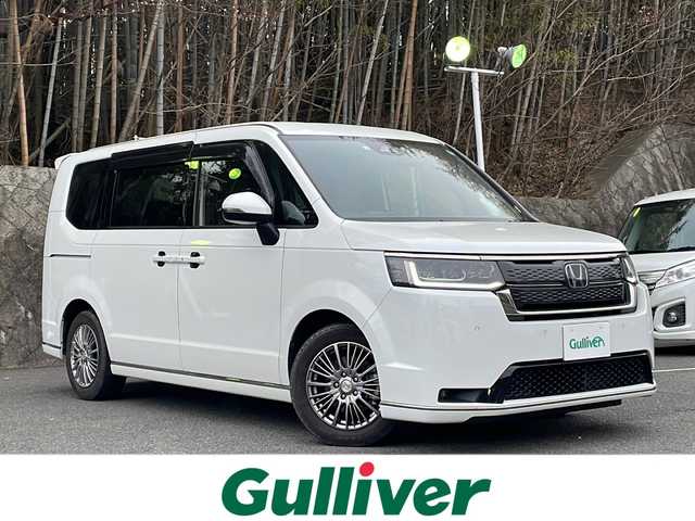 ホンダ ステップワゴン スパーダ eHEV 京都府 2022(令4)年 2万km プラチナホワイトパール ワンオーナー/純正ナビ/フルセグTV/Bluetooth Audio/CD/DVD/バックカメラ/レーダークルーズコントロール/両側パワースライドドア/パドルシフト/ビルトインETC/前後ドラレコ/パワーバックドア/シートヒーター(D.N席)/電動パーキングブレーキ/ステアリングスイッチ/オートライト/電格ウィンカーミラー/オートリトラクタブルミラー/プッシュスタート/純正ドアバイザー/純正フロアマット/保証書/取説/スペアキー