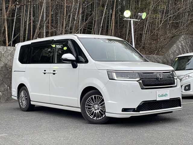 ホンダ ステップワゴン スパーダ eHEV 京都府 2022(令4)年 2万km プラチナホワイトパール ワンオーナー/純正ナビ/フルセグTV/Bluetooth Audio/CD/DVD/バックカメラ/レーダークルーズコントロール/両側パワースライドドア/パドルシフト/ビルトインETC/前後ドラレコ/パワーバックドア/シートヒーター(D.N席)/電動パーキングブレーキ/ステアリングスイッチ/オートライト/電格ウィンカーミラー/オートリトラクタブルミラー/プッシュスタート/純正ドアバイザー/純正フロアマット/保証書/取説/スペアキー