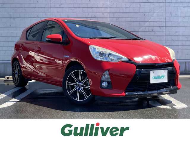トヨタ アクア G 静岡県 2013(平25)年 7.6万km スーパーレッドⅤ 純正メモリーナビ(NSCP-W62)/　AM FM CD Bluetooth ワンセグ/LEDオートヘッドランプ/革巻きステアリング/ステアリングスイッチ/スマートキー＆プッシュスタート/社外16インチアルミホイール/ECO/EV MODE/スポーツペダル/純正ラゲッジマット/純正フロアマット/レザー調シートカバー/ワンオーナー/ETC/バックモニター