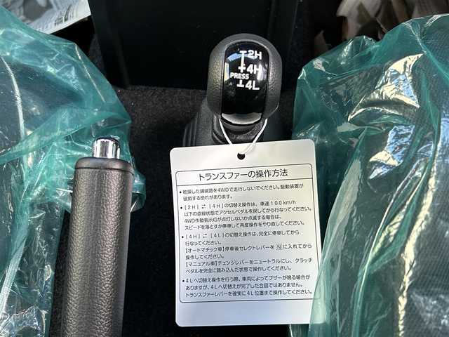 スズキ ジムニー ノマド FC 道東・釧路十勝 2025(令7)年 0.1千km Ｄグリーン 未使用/ワンオーナー/4WD/デュアルカメラブレーキサポート/・衝突被害軽減ブレーキ/・後退時ブレーキサポート/・誤発進抑制機能/・後方誤発進抑制機能/・アクティブクルーズコントロール/ステアリングスイッチ/アイドリングストップ/スマートキー/スペアキー/シートヒーター（D+N席）/背面タイヤ/純正AWサマータイヤ/横滑り防止装置/コーナーセンサー/レーンキープアシスト/オートライト/ダウンヒルアシストコントロール/純正LEDヘッドライト/保証書/取扱説明書/記録簿