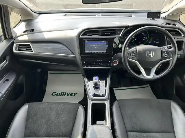 ホンダ シャトル ハイブリッド Z 山形県 2015(平27)年 7.3万km ホワイトオーキッドパール シティブレーキアクティブシステム/純正SDナビ/　　【CD DVD BT フルセグ USB AUX】/バックカメラ/クルーズコントロール/LEDオートヘッドライト/ハーフレザーシート/シートヒーター/純正16インチアルミホイール/ドライブレコーダー/アイドリングストップ/ステアリングスイッチ/パドルシフト/電動格納ウィンカーミラー/フォグランプ/スマートキー×2/ETC