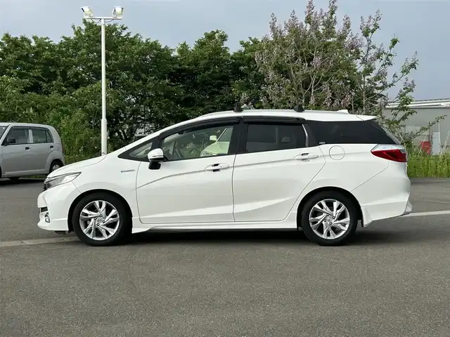 ホンダ シャトル ハイブリッド Z 山形県 2015(平27)年 7.3万km ホワイトオーキッドパール シティブレーキアクティブシステム/純正SDナビ/　　【CD DVD BT フルセグ USB AUX】/バックカメラ/クルーズコントロール/LEDオートヘッドライト/ハーフレザーシート/シートヒーター/純正16インチアルミホイール/ドライブレコーダー/アイドリングストップ/ステアリングスイッチ/パドルシフト/電動格納ウィンカーミラー/フォグランプ/スマートキー×2/ETC