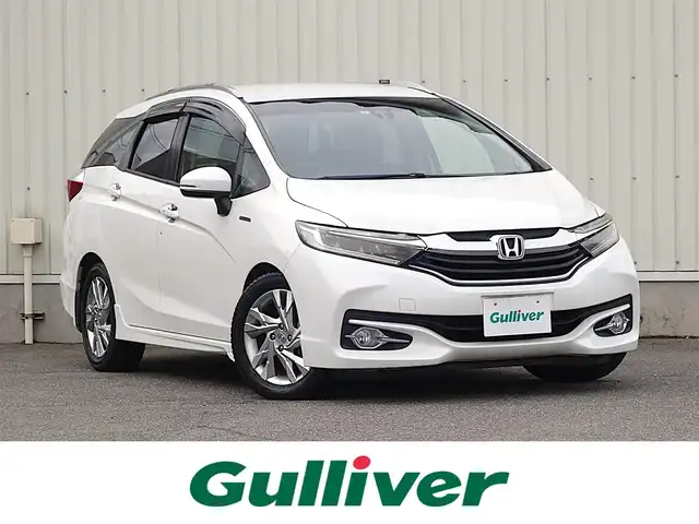 ホンダ シャトル ハイブリッド Z 山形県 2015(平27)年 7.3万km ホワイトオーキッドパール シティブレーキアクティブシステム/純正SDナビ/　　【CD DVD BT フルセグ USB AUX】/バックカメラ/クルーズコントロール/LEDオートヘッドライト/ハーフレザーシート/シートヒーター/純正16インチアルミホイール/ドライブレコーダー/アイドリングストップ/ステアリングスイッチ/パドルシフト/電動格納ウィンカーミラー/フォグランプ/スマートキー×2/ETC