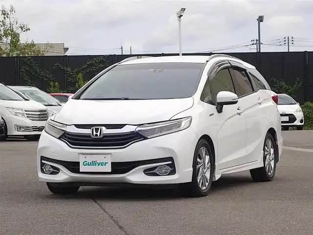 ホンダ シャトル ハイブリッド Z 山形県 2015(平27)年 7.3万km ホワイトオーキッドパール シティブレーキアクティブシステム/純正SDナビ/　　【CD DVD BT フルセグ USB AUX】/バックカメラ/クルーズコントロール/LEDオートヘッドライト/ハーフレザーシート/シートヒーター/純正16インチアルミホイール/ドライブレコーダー/アイドリングストップ/ステアリングスイッチ/パドルシフト/電動格納ウィンカーミラー/フォグランプ/スマートキー×2/ETC