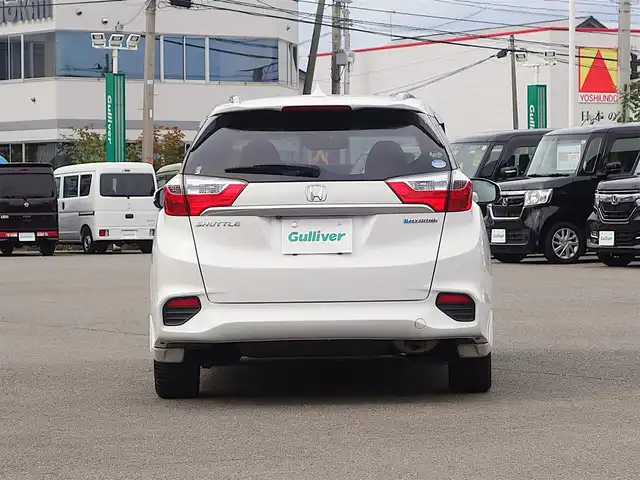 ホンダ シャトル ハイブリッド Z 山形県 2015(平27)年 7.3万km ホワイトオーキッドパール シティブレーキアクティブシステム/純正SDナビ/　　【CD DVD BT フルセグ USB AUX】/バックカメラ/クルーズコントロール/LEDオートヘッドライト/ハーフレザーシート/シートヒーター/純正16インチアルミホイール/ドライブレコーダー/アイドリングストップ/ステアリングスイッチ/パドルシフト/電動格納ウィンカーミラー/フォグランプ/スマートキー×2/ETC