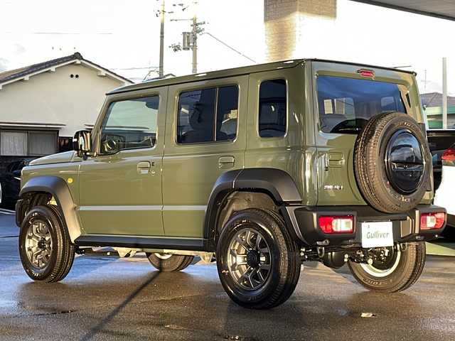 スズキ ジムニー ノマド FC 愛媛県 2025(令7)年 0.1万km未満 緑 ４WD/ワンオーナー/スマートキー/プッシュスタート/前席シートヒーター/レーダークルーズコントロール/衝突軽減ブレーキ/レーンキープアシスト/コーナーセンサー/ステアリングスイッチ/背面タイヤ/オートライト/オートハイビーム/電動格納ミラー/ライトレベライザー/ヘッドライトウォッシャー