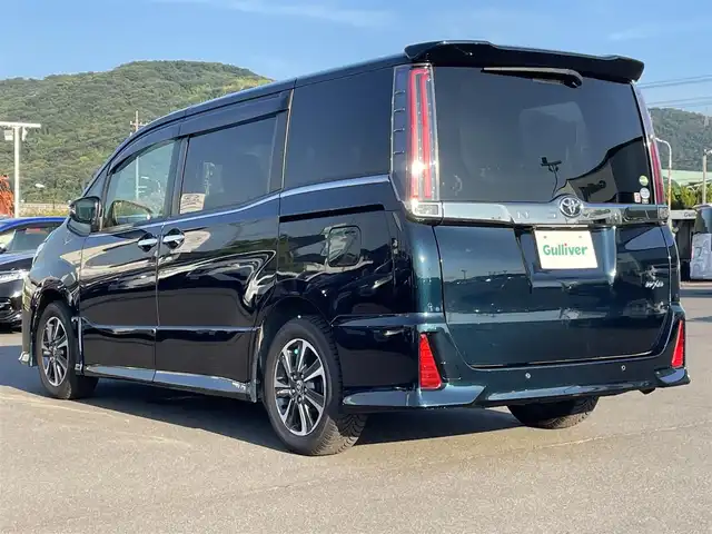 トヨタ ノア Si ダブルバイビーⅡ 岡山県 2019(平31)年 6.2万km ブラッキッシュアゲハガラスフレーク 登録時走行距離61665km/純正10インチナビ【AM/FM/BT/フルセグTV】/バックカメラ/両側パワースライドドア/ETC2.0/ドライブレコーダー/ハーフレザーシート/クルーズコントロール/衝突被害軽減システム/レーンキープアシスト/コーナーセンサー/横滑防止装置/純正LEDヘッドライト/オートライト/オートマチックハイビーム/MTモード付きAT/アイドリングストップ/純正アルミホイール 16インチ/ドアバイザー/純正フロアマット