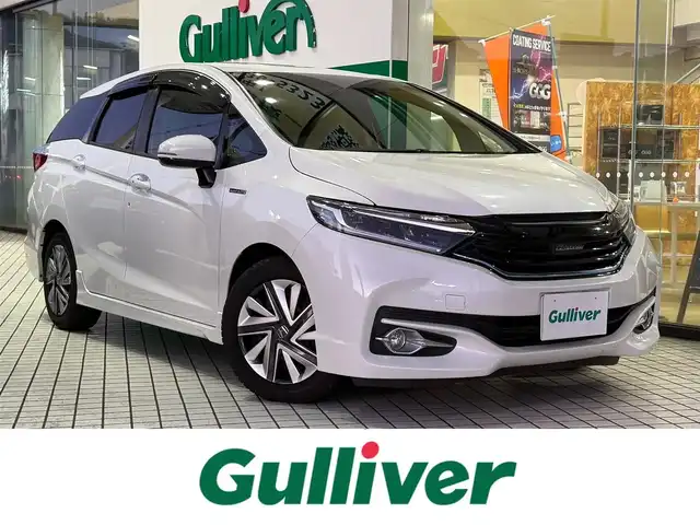 ホンダ シャトル ハイブリッド X 京都府 2015(平27)年 11.1万km ホワイトオーキッドパール 純正インターナビ、Bluetooth/CD/DVD/USB/HDMI/パドルシフト/LEDヘッドランプ/ビルトインETC/ステアリングスイッチ/クルーズコントロール