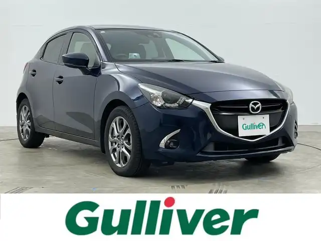 マツダ デミオ 岡山県 2016(平28)年 2.3万km ディープクリスタルブルーマイカ 純正ナビ　/シートヒーター　/ＬＥＤヘッドライト　/ＥＴＣ　/クルーズコントロール　/ブラインドスポットモニター　/フルセグ　/Ｂｌｕｅｔｏｏｔｈ　/スマートキー　/アイドリングストップ　/オートライト　/フォグライト/禁煙車/ヘッドアップディスプレイ/パドルシフト