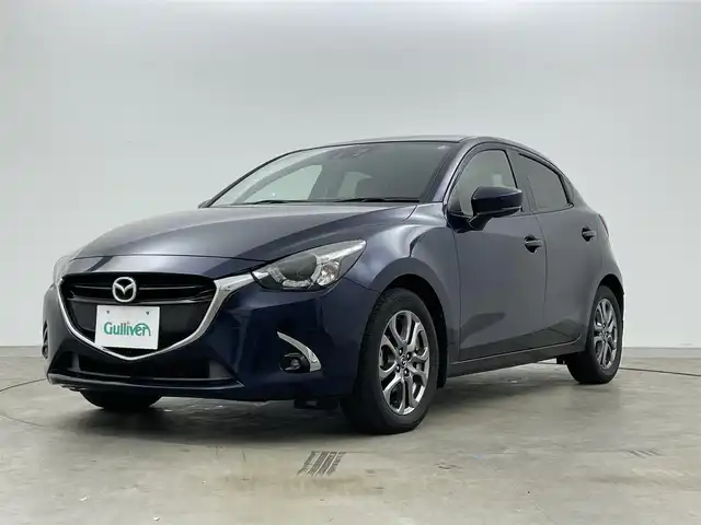 マツダ デミオ 岡山県 2016(平28)年 2.3万km ディープクリスタルブルーマイカ 純正ナビ　/シートヒーター　/ＬＥＤヘッドライト　/ＥＴＣ　/クルーズコントロール　/ブラインドスポットモニター　/フルセグ　/Ｂｌｕｅｔｏｏｔｈ　/スマートキー　/アイドリングストップ　/オートライト　/フォグライト/禁煙車/ヘッドアップディスプレイ/パドルシフト