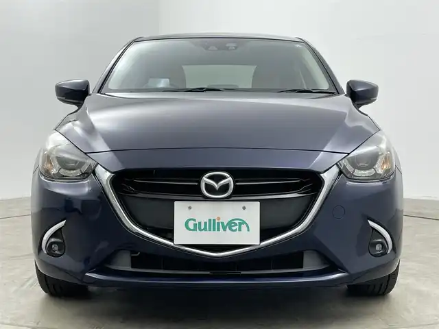 マツダ デミオ 岡山県 2016(平28)年 2.3万km ディープクリスタルブルーマイカ 純正ナビ　/シートヒーター　/ＬＥＤヘッドライト　/ＥＴＣ　/クルーズコントロール　/ブラインドスポットモニター　/フルセグ　/Ｂｌｕｅｔｏｏｔｈ　/スマートキー　/アイドリングストップ　/オートライト　/フォグライト/禁煙車/ヘッドアップディスプレイ/パドルシフト