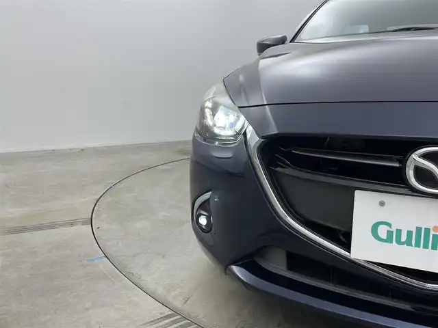 マツダ デミオ 岡山県 2016(平28)年 2.3万km ディープクリスタルブルーマイカ 純正ナビ　/シートヒーター　/ＬＥＤヘッドライト　/ＥＴＣ　/クルーズコントロール　/ブラインドスポットモニター　/フルセグ　/Ｂｌｕｅｔｏｏｔｈ　/スマートキー　/アイドリングストップ　/オートライト　/フォグライト/禁煙車/ヘッドアップディスプレイ/パドルシフト