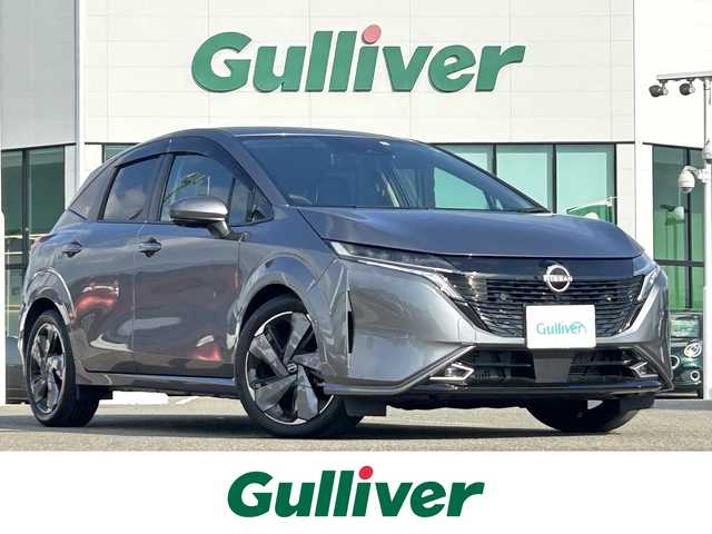 日産 オーラ G レザーエディション 佐賀県 2023(令5)年 0.7万km ダークメタルグレー ワンオーナー/プロパイロット/エマージェンシーブレーキ/アラウンドビューモニター/全方位運転支援システム/ハンドル支援/レーンアシスト/アダプティブクルーズコントロール/純正9インチメモリーナビゲーション/フルセグTV Bluetooth USB HDMI/革巻きステアリング/ステアリングリモコン/革シート/インテリキー/BOSSプレミアムサウンド/デジタルインナーミラー/置くだけ充電/純正ドライブレコーダー/ビルトインETC2.0/フロアマット/LEDオートヘッドライト/LEDフォグランプ/オートマチックハイビーム/純正17インチアルミホイール
