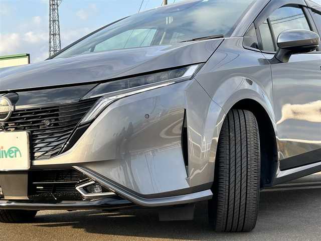 日産 オーラ G レザーエディション 佐賀県 2023(令5)年 0.7万km ダークメタルグレー ワンオーナー/プロパイロット/エマージェンシーブレーキ/アラウンドビューモニター/全方位運転支援システム/ハンドル支援/レーンアシスト/アダプティブクルーズコントロール/純正9インチメモリーナビゲーション/フルセグTV Bluetooth USB HDMI/革巻きステアリング/ステアリングリモコン/革シート/インテリキー/BOSSプレミアムサウンド/デジタルインナーミラー/置くだけ充電/純正ドライブレコーダー/ビルトインETC2.0/フロアマット/LEDオートヘッドライト/LEDフォグランプ/オートマチックハイビーム/純正17インチアルミホイール
