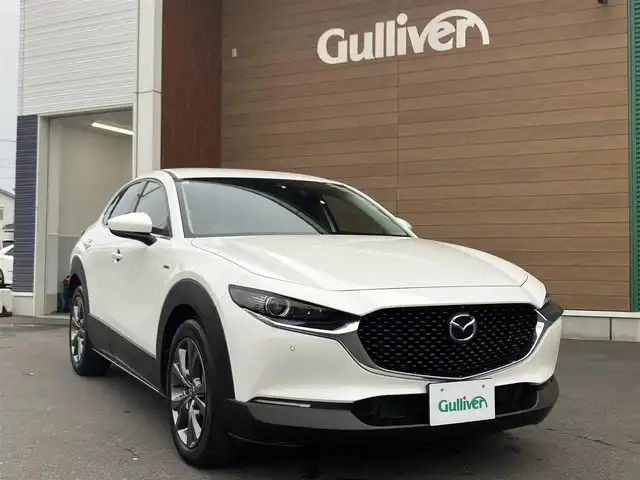 マツダ ＣＸ－３０ 20S 100周年特別記念車 埼玉県 2020(令2)年 1.5万km スノーフレイクホワイトパールマイカ 登録時14206km/6速マニュアル/i-ACTIVSENSE/　・スマートブレーキサポート（SBS）/　・レーンキープアシストシステム（LAS）/　・マツダレーダークルーズコントロール（MRCC）/　・クルージング&トラフィックサポート（CTS）/　・ブラインドスポットモニタリング（BSM）/　・交通標識認識システム（TSR）/　・前後誤発進抑制制御/赤革シート/　・パワーシート（メモリー機能付き）/　・前席シートヒーター/純正メーカーコネクトナビ/　・BOSEサウンド/　・フルセグTV/　・CD/DVD再生/　・Bluetooth接続/　・HDMI/USB端子/360°セーフティパッケージ/　・360°ビューモニター/　・ドライバーモニタリング/　・フロントパーキングセンサー/純正ドライブレコーダー（前後タイプ）/電子パーキングブレーキ/パワーバックドア/LEDヘッドライト/オートハイビーム/アドバンスドキー×2/プッシュスタートボタン/革巻きステアリング/ステアリングヒーター/純正18インチAW/クリアランスソナー/保証書/取扱説明書/ナビ取扱説明書/マツダ整備記録簿（R3.R4.R5.R6）