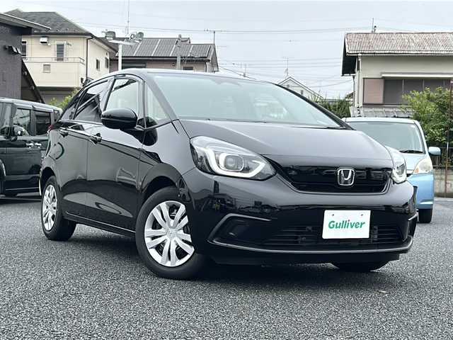 ホンダ フィット ホーム 東京都 2021(令3)年 6.8万km クリスタルブラックパール Honda SENSING/・衝突軽減ブレーキ/・誤発進抑制機能/・後方誤発進抑制機能/・近距離衝突軽減ブレーキ/・歩行者事故低減ステアリング/・路外逸脱抑制機能/・渋滞追従機能付アダプティブ/・クルーズ・コントロール/・車線維持支援システム/・先行車発進お知らせ機能/・標識認識機能/・オートハイビーム/純正メモリナビ（VXM-205VFEi）/・フルセグTV/Bluetooth/AUX/LEDヘッドライト/チップアップシート/電動格納ミラー/取扱説明書/保証書