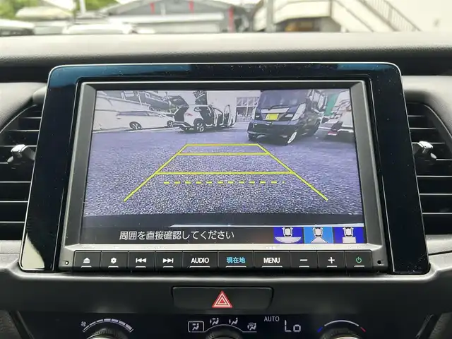 ホンダ フィット ホーム 東京都 2021(令3)年 6.8万km クリスタルブラックパール Honda SENSING/・衝突軽減ブレーキ/・誤発進抑制機能/・後方誤発進抑制機能/・近距離衝突軽減ブレーキ/・歩行者事故低減ステアリング/・路外逸脱抑制機能/・渋滞追従機能付アダプティブ/・クルーズ・コントロール/・車線維持支援システム/・先行車発進お知らせ機能/・標識認識機能/・オートハイビーム/純正メモリナビ（VXM-205VFEi）/・フルセグTV/Bluetooth/AUX/LEDヘッドライト/チップアップシート/電動格納ミラー/取扱説明書/保証書