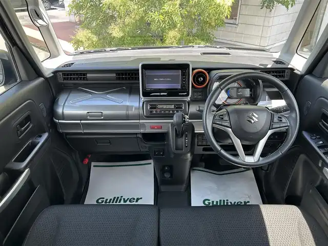 スズキ スペーシア ギア HYBRID XZターボ 岡山県 2019(平31)年 3.3万km ブルーイッシュブラックパール3 純正ナビ　　CN-RZ743W/Bluetooth、AM、FM、フルセグTV、CD、DVD/パドルシフト/両側パワースライドドア/シートバックテーブル/前席シートヒーター/クルーズコントロール（追従機能なし）/スリムサーキュレーター/後席ロールサンシェード/オートライト/レーンキープアシスト/ビルトインETC/純正フロアマット/横滑り防止装置/盗難防止装置/スズキセーフティサポート/・デュアルカメラブレーキサポート/・後退時サポートブレーキ/・車線逸脱抑制機能/・車線逸脱警報機能/・ふらつき警報/・標識認識機能/・先行車発進お知らせ機能