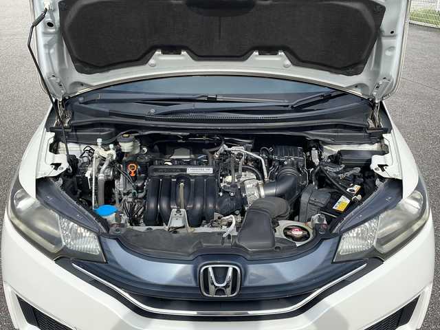 ホンダ フィット 13G Fパッケージ 富山県 2013(平25)年 15.1万km プレミアムホワイトパール 禁煙車　/純正ナビ　/地デジ　/バックカメラ　/スマートキー　/純正アルミホイール　/純正オーディオ　/ウィンカーミラー　/電動格納ミラー　/アイドリングストップ　/ＥＴＣ　/プッシュスタート